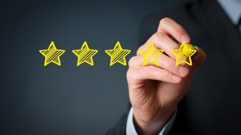 Image: Five-star rating review stars representing positive feedback and customer satisfaction
